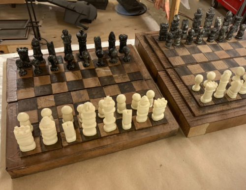 hand carved soap and cardboard chess set prop