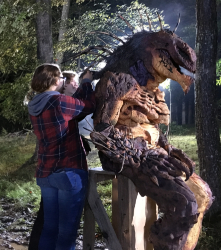 jackie and devin tend to the animatronic monster suit
