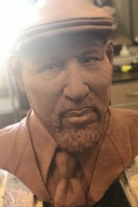 A larger than life sized clay bust of the the playwright August Wilson sculpted by Kyle Roberst