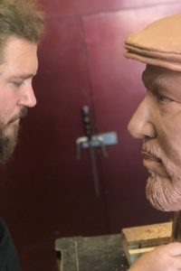 A larger than life sized clay bust of the the playwright August Wilson sculpted by Kyle Roberst